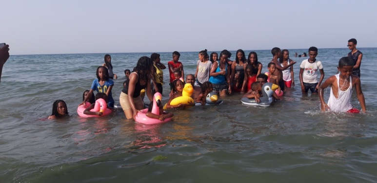 children from the Good Samaritan Sisters orphanage play in the water