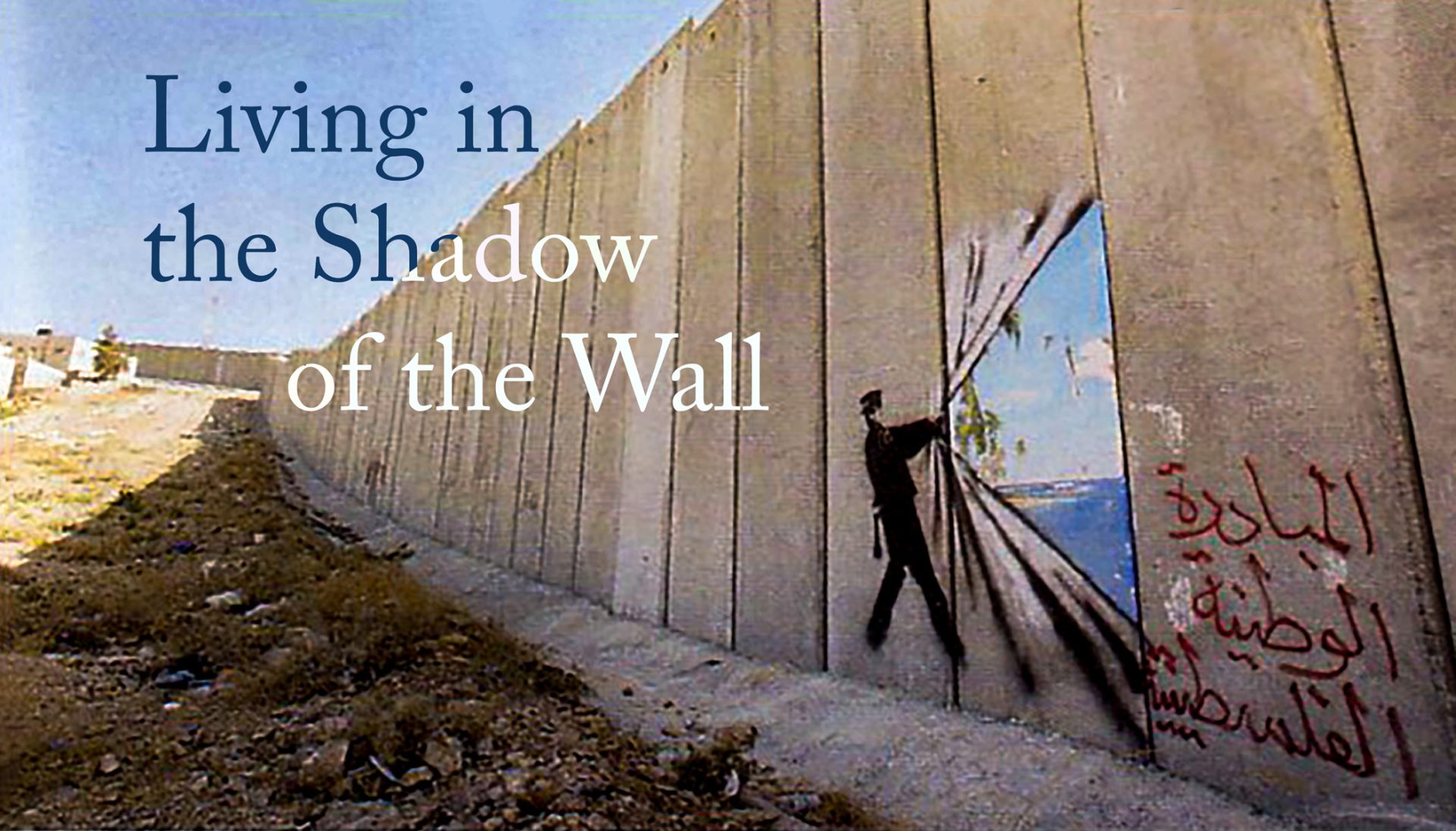 Living in the Shadow of the Wall Painted on the West Bank Wall is the image of man pulling open the wall to reveal water, blue skies and sunlight on the other side