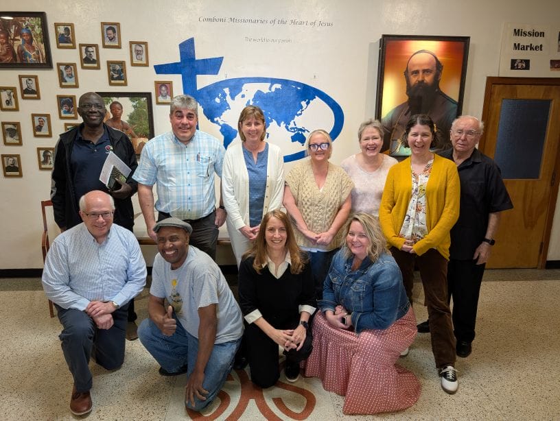 Fr Domingues Visit April 2025 resized Fr Domingues stands with employees of the Cincinnati community